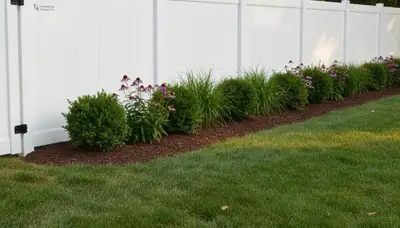 White privacy fence installation by Chop Chop Landscaping in Harrisburg, PA showcasing expert craftsmanship